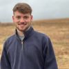 A portrait photograph of Jake Thomas Hollyman on a moor.