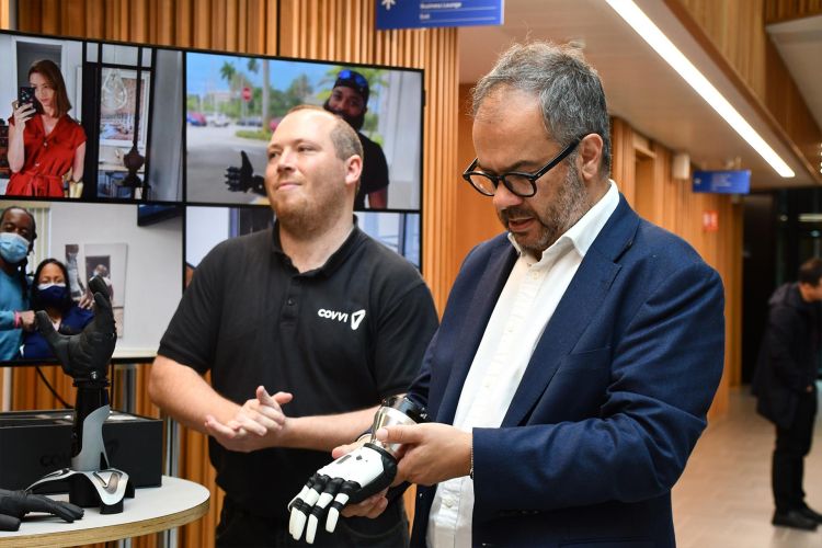 Paul Scully MP holding the multi-articulated bionic COVVI hand.