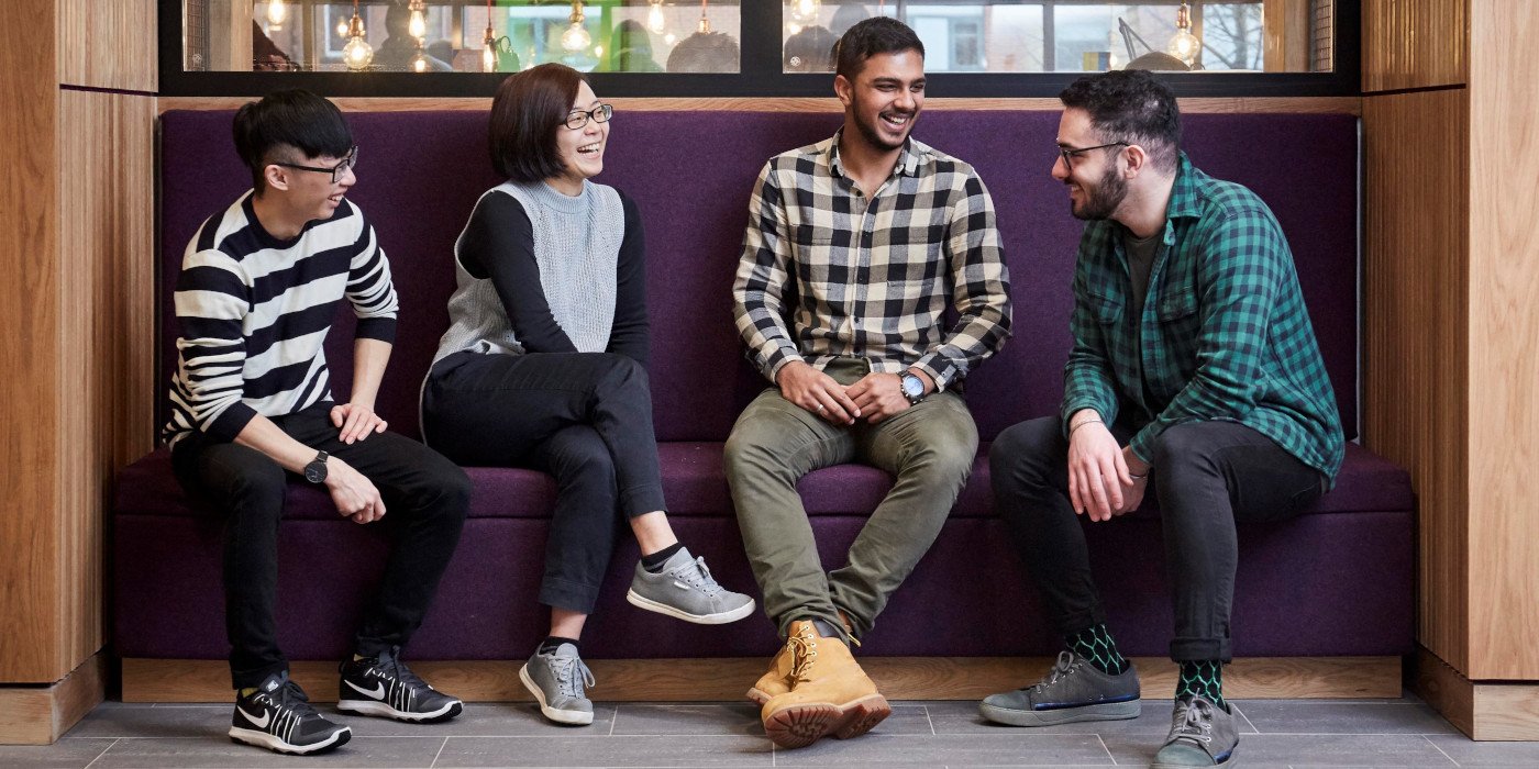 Students talking on a sofa