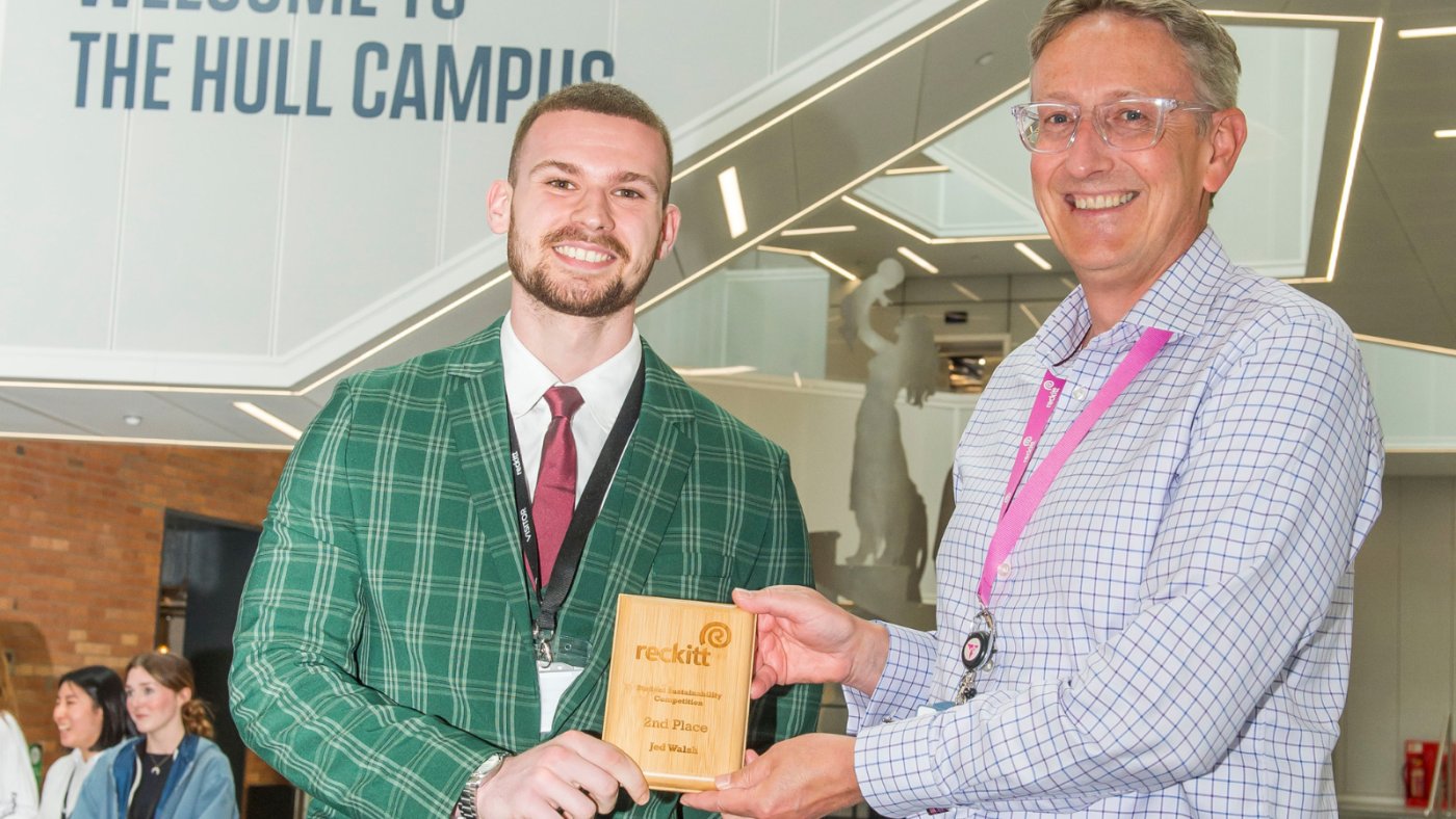 Jed walsh being presented with the second place prize by Reckitt