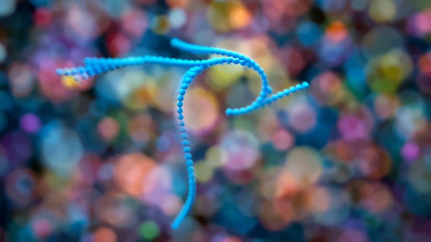 A visualisation of a swirling cell cluster on a colourful background
