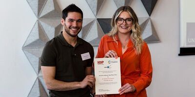 Harry Laurent receiving a certficate for his Don McKenzie Paul Prize for 2023.
