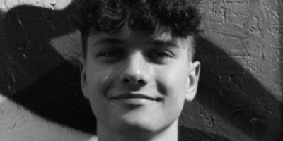 A cropped black and white portrait of Joshua Searson.