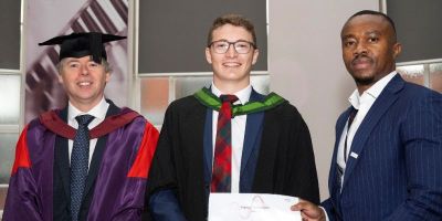 Euan Robertson being presented with the Keysight Prize 2023. certificate.