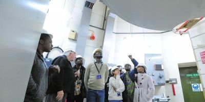 Research team looking at radio astronomy equipment in a lab