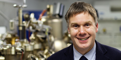 Professor Edmund Linfield standing in front terahertz technology.