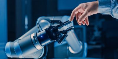 human hand interacting with robot