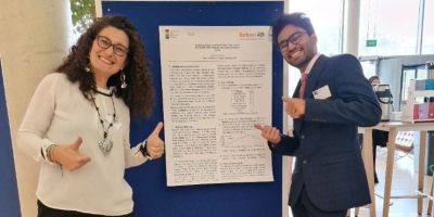 Nipun Surana and Professor Luisa Cutillo presenting a poster display