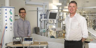 Dr Pete Culmer, left, with Dr David Brettle and one of the adapted machines. 