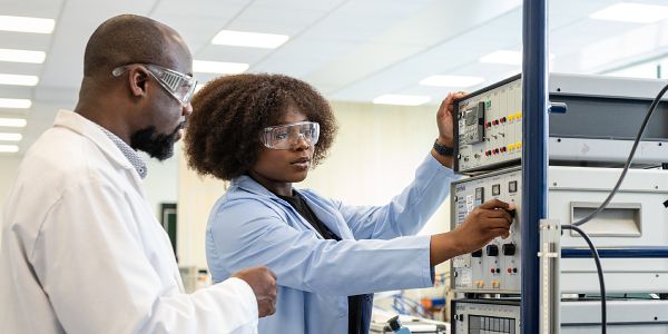Chemical engineering student in a laboratory with a teacher