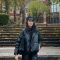Fatima Mammadova - female student on campus standing next to great hall