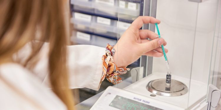 Close up photo of Adele Parry working in a laboratory