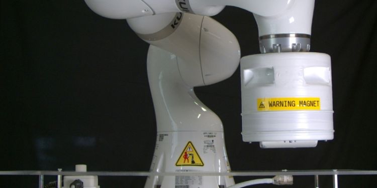 External permanent magnet mounted onto a robotic arm to control the magnetic endoscope. 