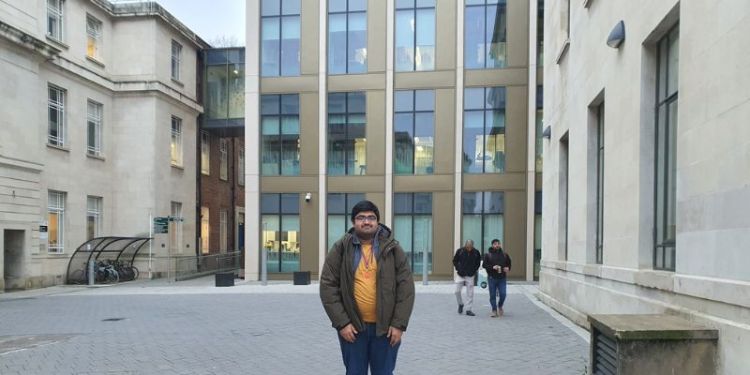 Computing student outside the Bragg building