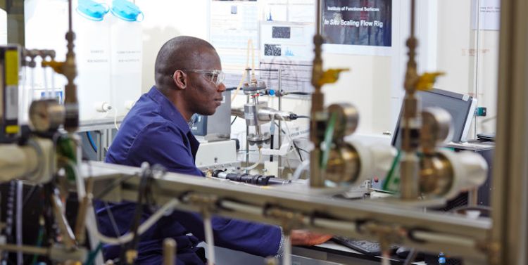 IFS researcher in corrosion lab