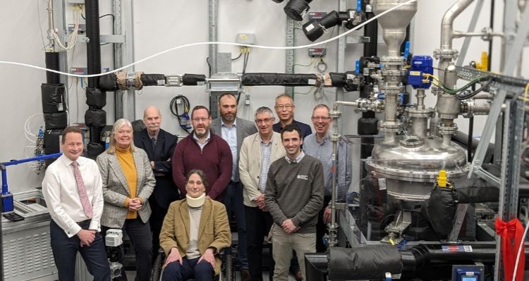 Stakeholders at the launch of MULTIForm facility, posing for a group photo in front of equipment.