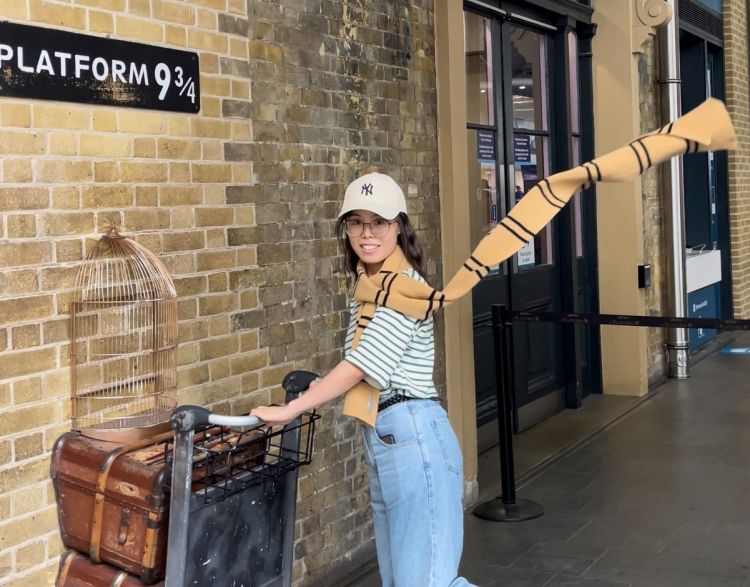 Yanlan Zhang - female student posing on platform 9 3/4